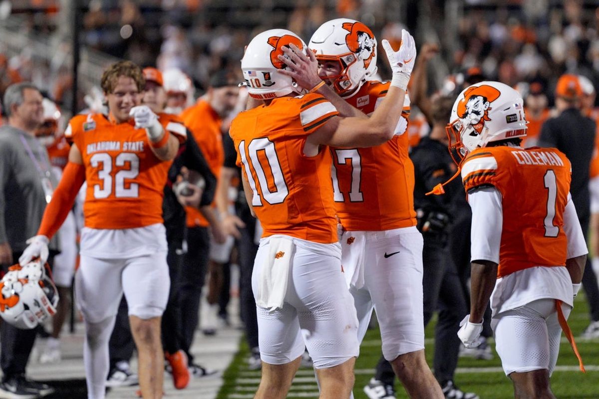 Oklahoma State Cowboys quarterback Drew Mestemaker (17) and wide receiver Wyatt Young (10) celebrate after a touchdown during a college football game between the Oklahoma State Cowboys (OSU) and the Colorado Buffaloes at Boone Pickens Stadium in Stillwater, Okla., Saturday, Oct. 24, 2026. Oklahoma State won 57-24.