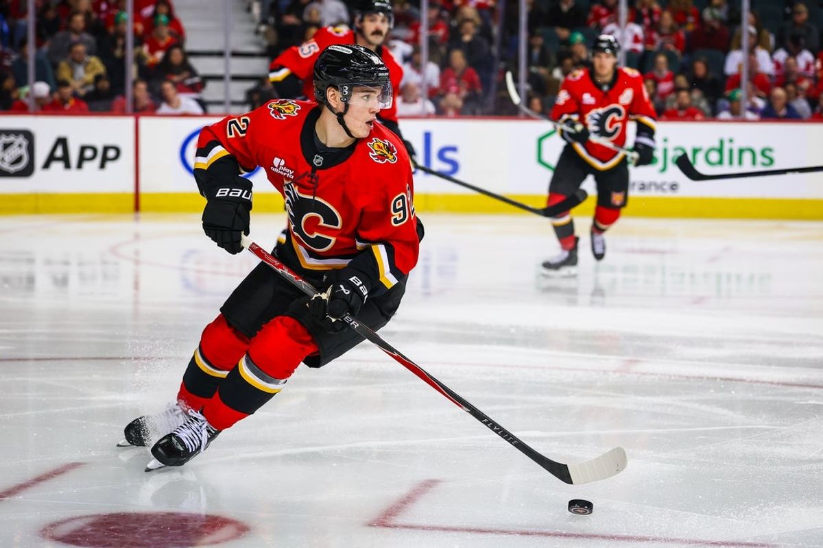 Oct 24, 2026; Calgary, Alberta, CAN; Calgary Flames right wing Matvei Gridin (92) controls the puck against the Detroit Red Wings during the third period at Scotiabank Saddledome. Mandatory Credit: Sergei Belski-Imagn Images