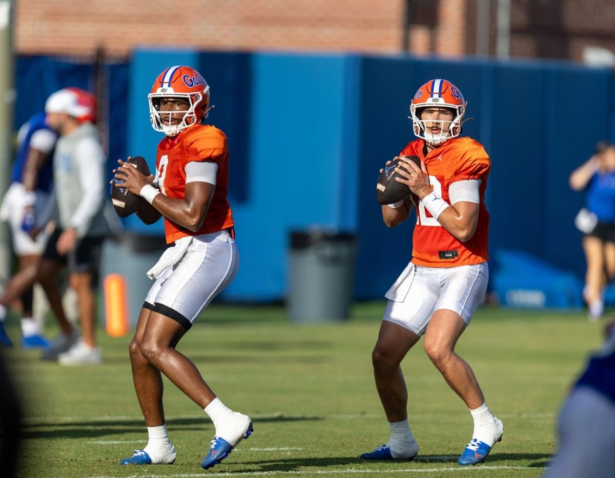 Florida quarterback Tramell Jones Jr. (9) and Florida quarterback Aaron Philo (12) throw during Florida Football Fall camp practice availability at Heavener Football Training Center in Gainesville, FL on Friday, August 7, 2026. [Alan Youngblood/Gainesville Sun]
