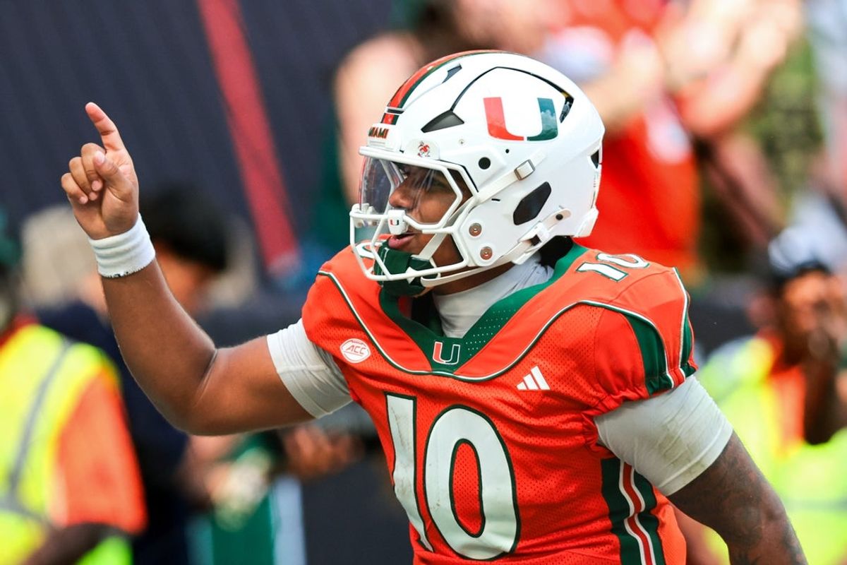 Oct 24, 2026; Miami Gardens, Florida, USA; Miami Hurricanes quarterback Darian Mensah (10) celebrates after throwing a touchdown pass against the Pittsburgh Panthers during the fourth quarter at Hard Rock Stadium. Mandatory Credit: Sam Navarro-Imagn Images