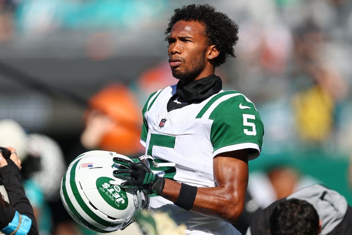Oct 25, 2026; East Rutherford, New Jersey, USA;  New York Jets wide receiver Garrett Wilson (5) looks on during warmups before a game against the Miami Dolphins at MetLife Stadium.  Mandatory Credit: Vincent Carchietta-Imagn Images