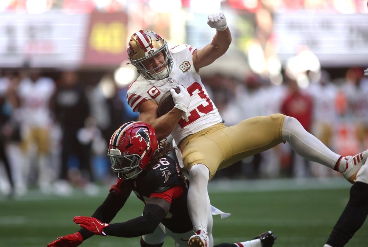 Oct 25, 2026; Atlanta, Georgia, USA;  San Francisco 49ers running back Christian McCaffrey (23) is tackled by Atlanta Falcons linebacker Harold Perkins Jr. (56) during the first quarter against the Atlanta Falcons at Mercedes-Benz Stadium.  Mandatory Credit: Brett Davis-Imagn Images