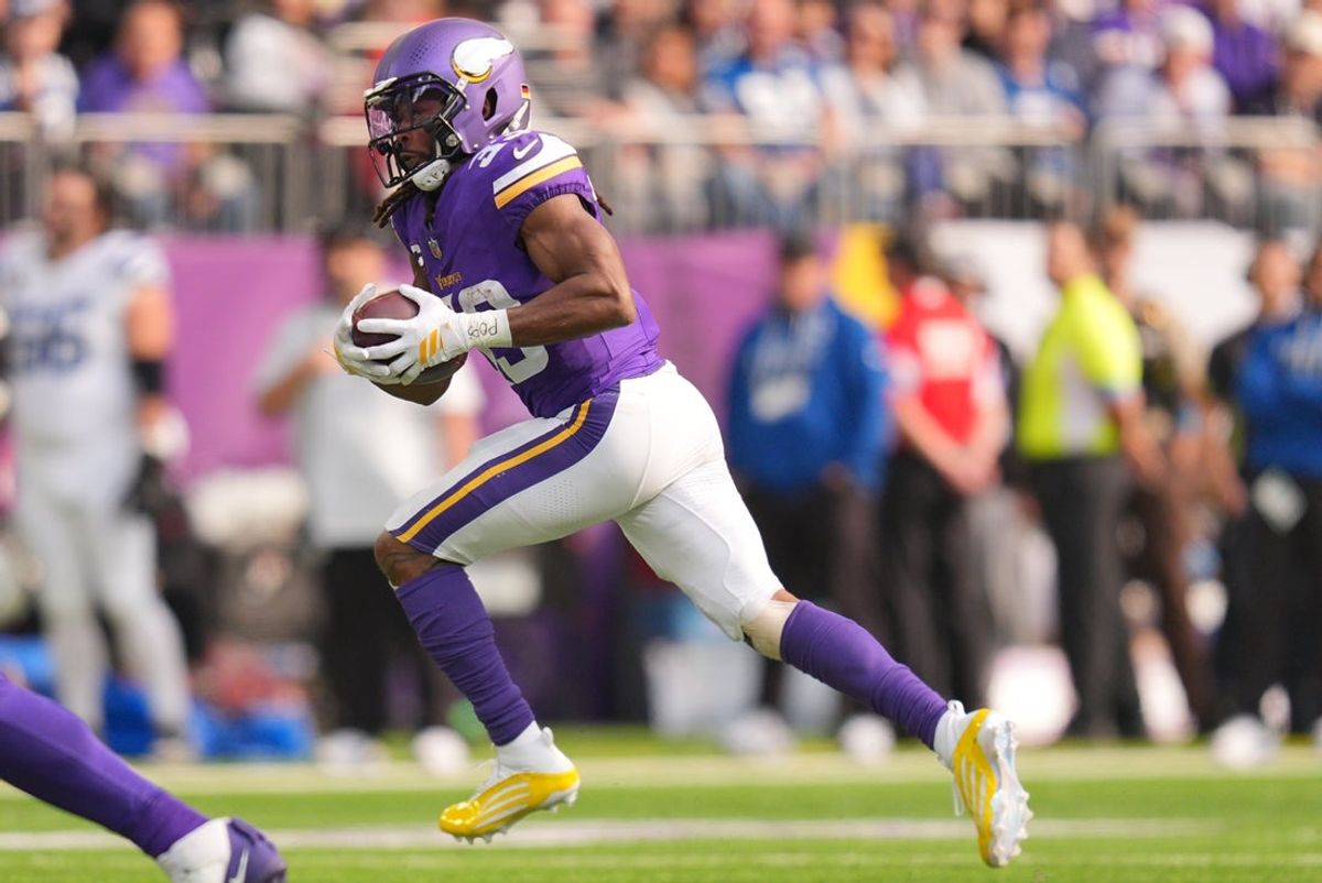 Oct 25, 2026; Minneapolis, Minnesota, USA;  Minnesota Vikings running back Aaron Jones Sr. (33) rushes the ball against the Indianapolis Colts in the first half at U.S. Bank Stadium.  Mandatory Credit: Brad Rempel-Imagn Images