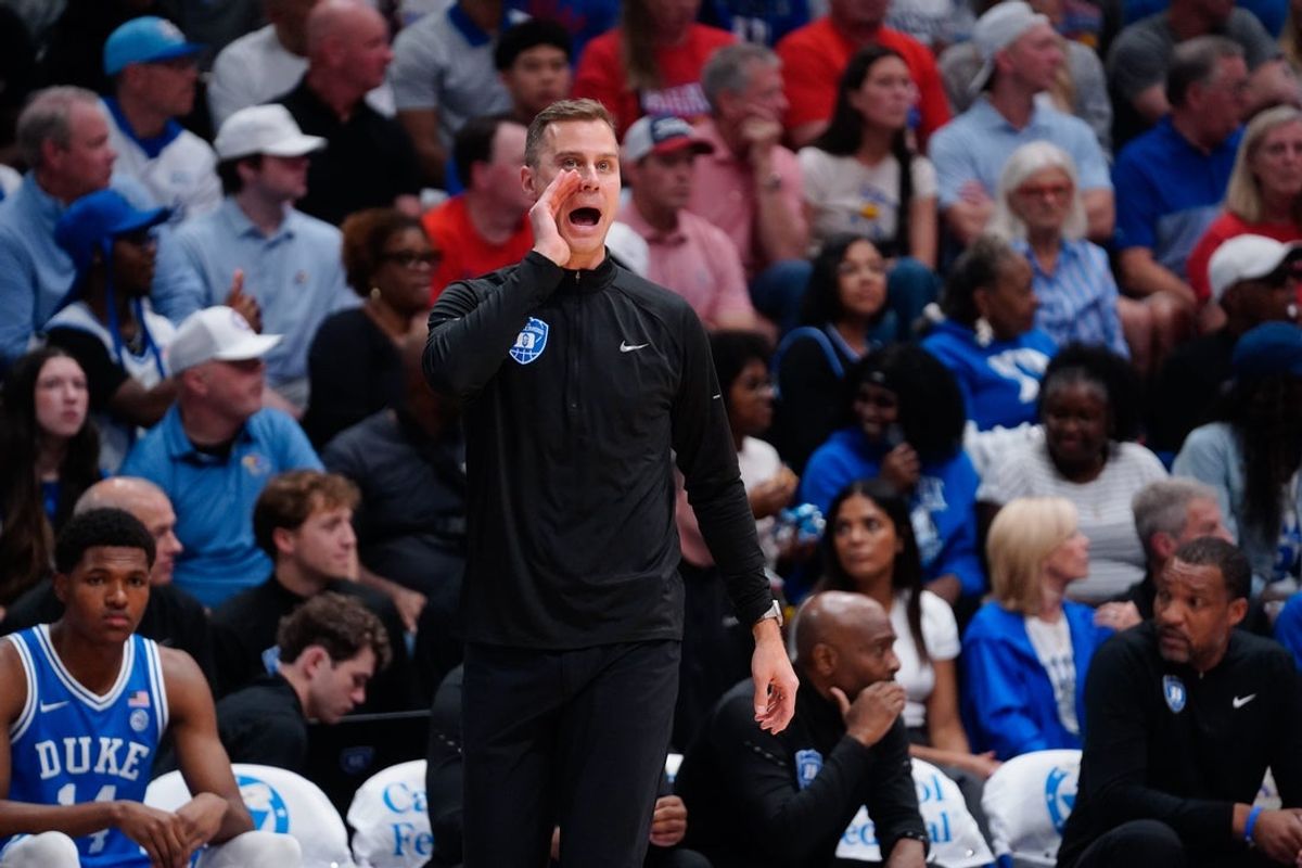 Duke Blue Devils head coach Jon Scheyer yells out during the exhibition game against Kansas Jayhawks inside Allen Fieldhouse in Lawrence, Kansas on Oct. 25, 2026.