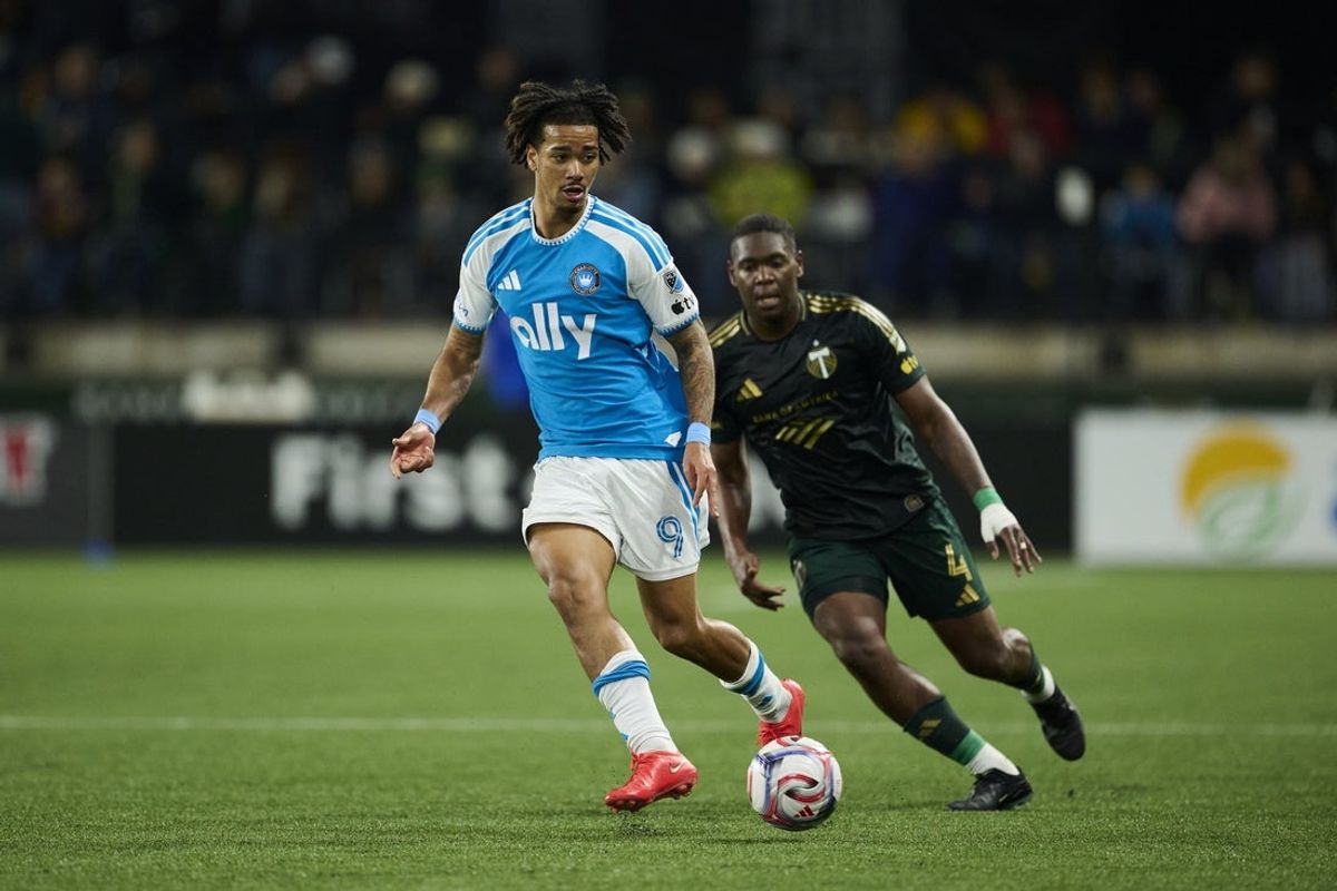 Oct 24, 2026; Portland, Oregon, USA; Charlotte FC forward Idan Toklomati (9) passes the ball during the second half against Portland Timbers defender Kamal Miller (4) at Providence Park. Mandatory Credit: Troy Wayrynen-Imagn Images
