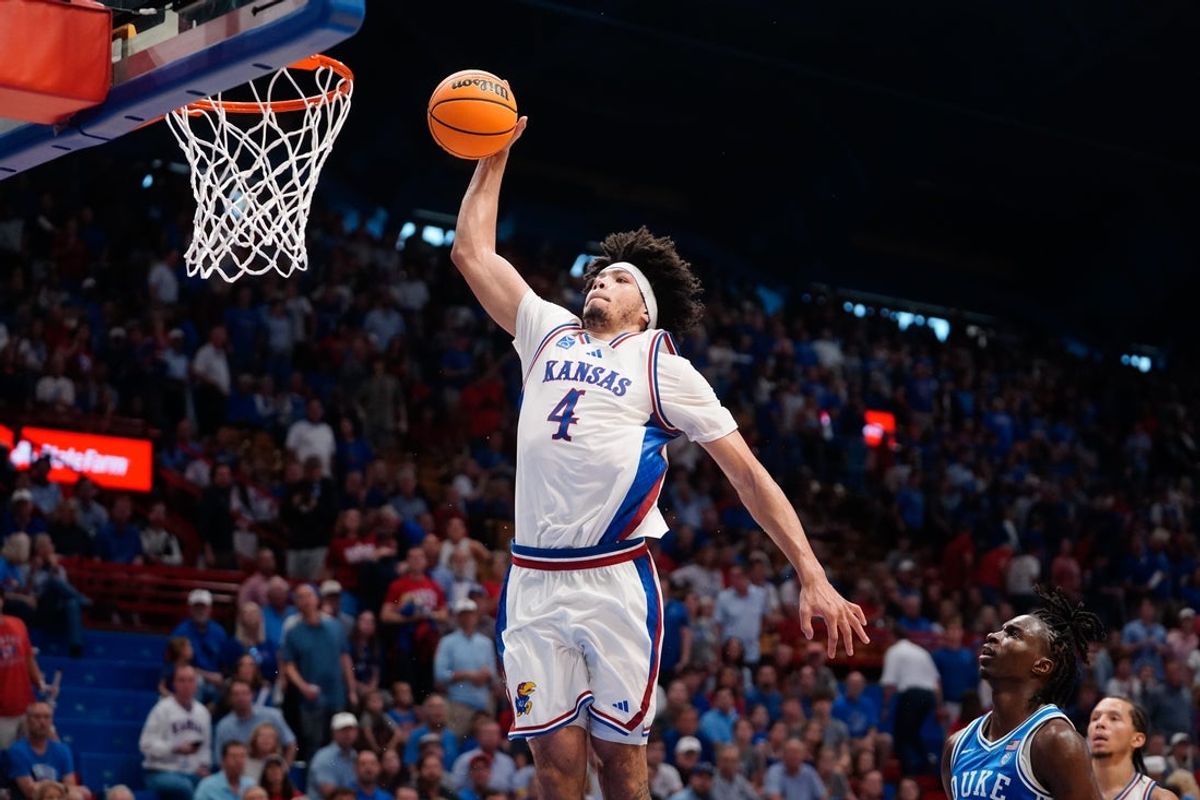 Kansas Jayhawks guard Tyran Stokes (4) jumps for a dunk against Duke Blue Devils during the exhibition game inside Allen Fieldhouse in Lawrence, Kansas on Oct. 25, 2026.