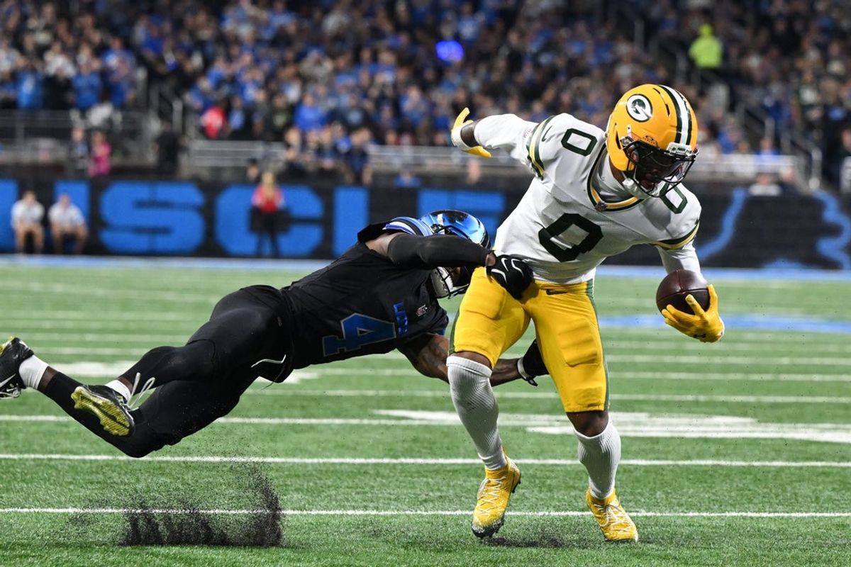 Oct 25, 2026; Detroit, Michigan, USA;  Green Bay Packers wide receiver Matthew Golden (0) is tackled by Detroit Lions cornerback D.J. Reed (4) during the second quarter at Ford Field.  Mandatory Credit: Lon Horwedel-Imagn Images
