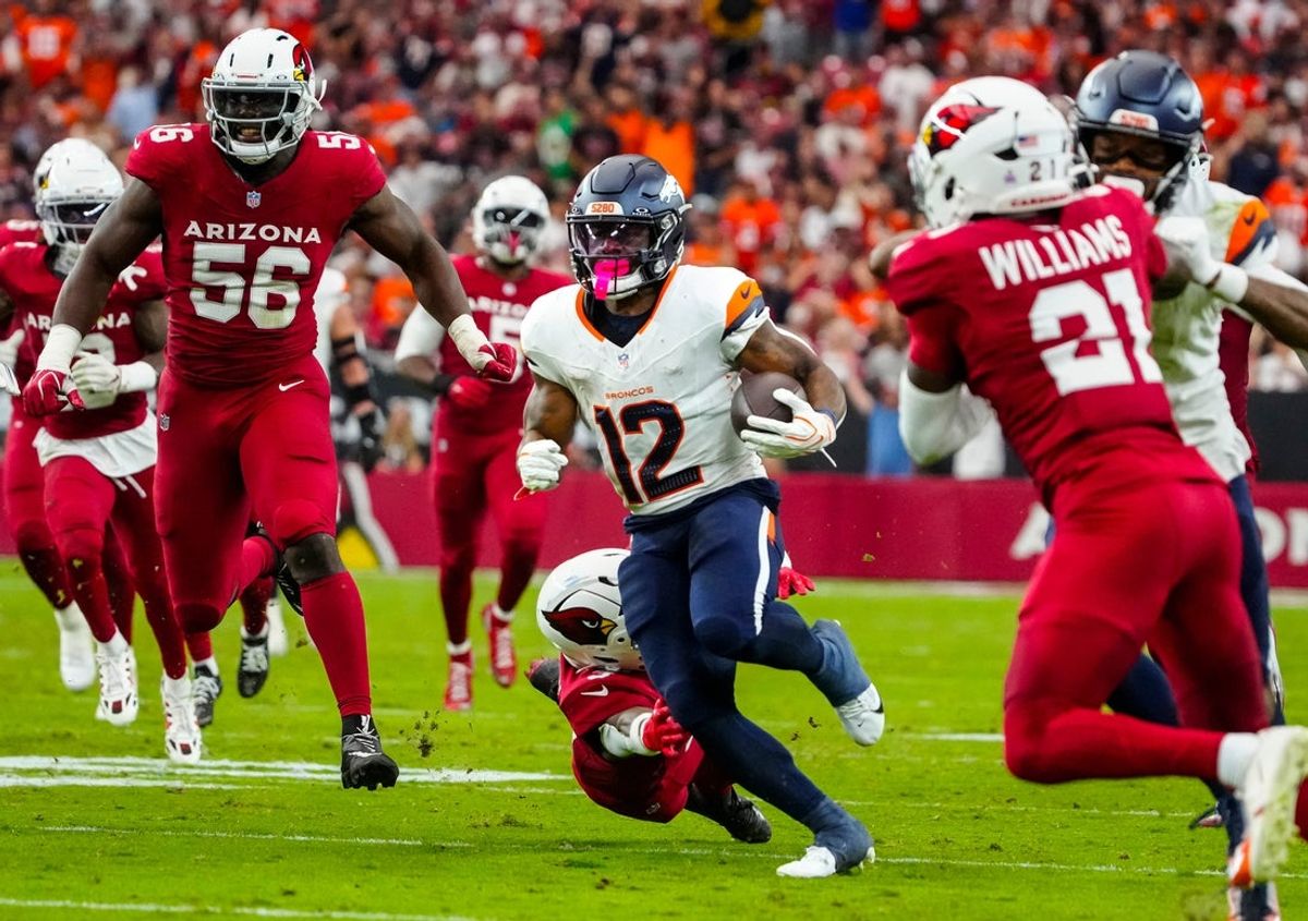 Denver Broncos running back RJ Harvey (12) runs for a touchdown against the Arizona Cardinals during a game at State Farm Stadium in Glendale, Ariz. on Oct. 24, 2026.