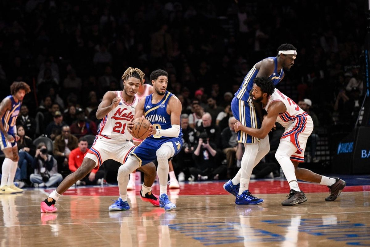 Oct 25, 2026; Brooklyn, New York, USA;  Indiana Pacers guard Tyrese Haliburton (0) looks to pass the ball as Brooklyn Nets forward Noah Clowney (21) defends during the first half at Barclays Center.  Mandatory Credit: John Jones-Imagn Images
