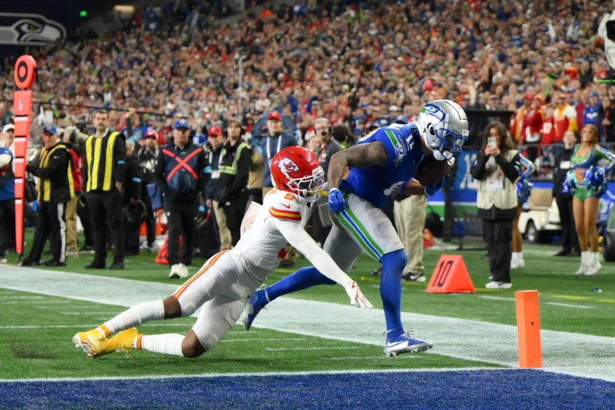 Oct 25, 2026; Seattle, Washington, USA;  Seattle Seahawks wide receiver Jaxon Smith-Njigba (11) scores a touchdown defended by Kansas City Chiefs cornerback Mansoor Delane (5) during the second quarter at Lumen Field.  Mandatory Credit: Steven Bisig-Imagn Images
