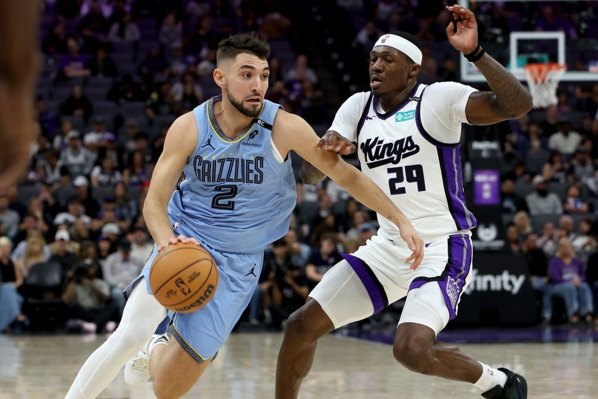 Oct 25, 2026; Sacramento, California, USA;  Memphis Grizzlies guard-forward Ty Jerome (2) drives the ball around Sacramento Kings guard-forward Daeqwon Plowden (29) during the second quarter at Golden 1 Center.  Mandatory Credit: Dennis Lee-Imagn Images