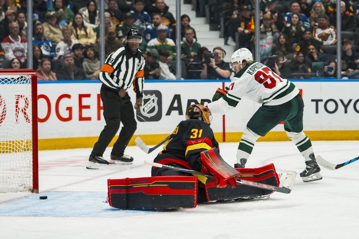 Oct 25, 2026; Vancouver, British Columbia, CAN;  Minnesota Wild forward Kirill Kaprizov (97) scores on Vancouver Canucks goalie Leevi Merilainen (31) in the third period at Rogers Arena.  Mandatory Credit: Bob Frid-Imagn Images