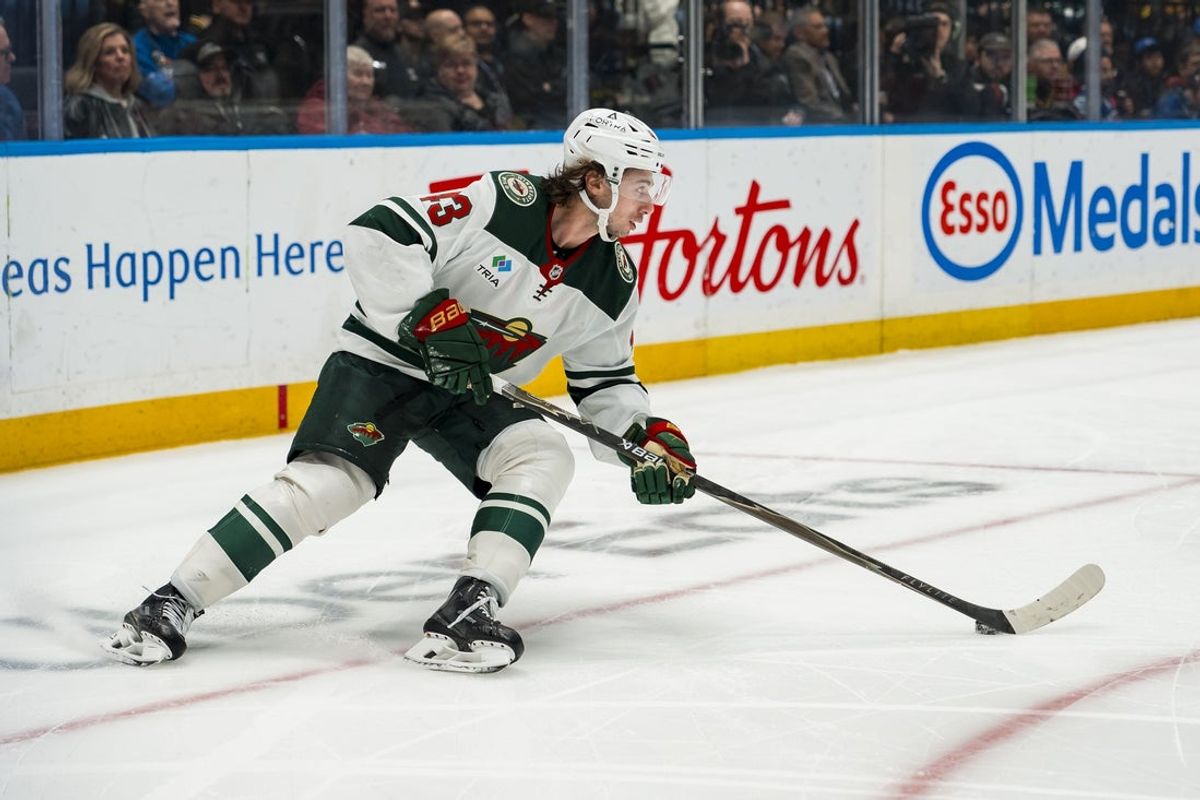 Oct 25, 2026; Vancouver, British Columbia, CAN;  Minnesota Wild defenseman Quinn Hughes (43) handles the puck against the Vancouver Canucks in the second period at Rogers Arena.  Mandatory Credit: Bob Frid-Imagn Images