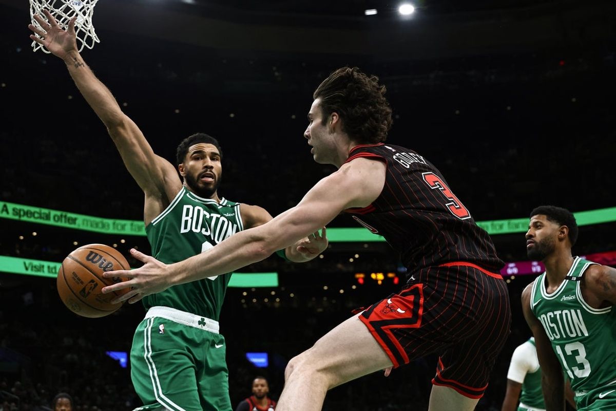 Oct 26, 2026; Boston, Massachusetts, USA; Chicago Bulls guard Josh Giddey (3) dishes a pass past Boston Celtics forward Jayson Tatum (0) during the first quarter at TD Garden. Mandatory Credit: Winslow Townson-Imagn Images