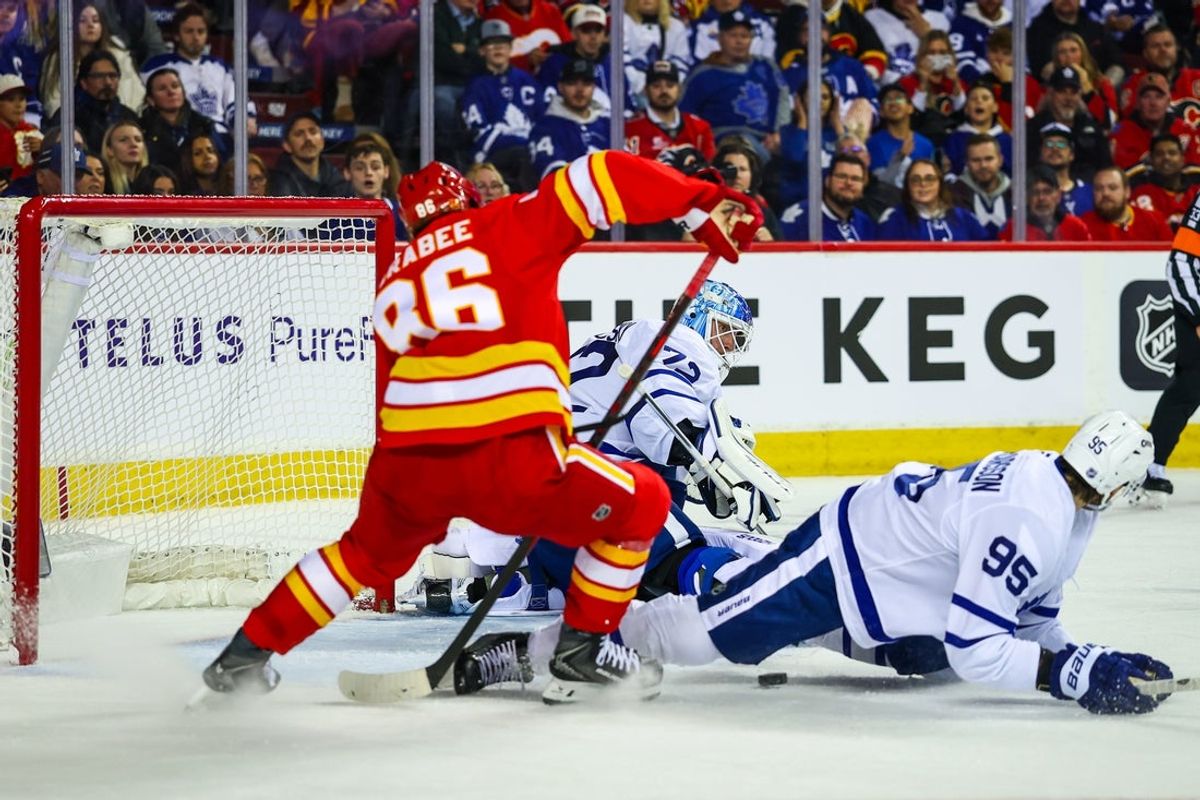 Oct 26, 2026; Calgary, Alberta, CAN; Toronto Maple Leafs defenseman Oliver Ekman-Larsson (95) blocks a pass in front of Toronto Maple Leafs goaltender Sergei Bobrovsky (72) during the second period against the Calgary Flames at Scotiabank Saddledome. Mandatory Credit: Sergei Belski-Imagn Images