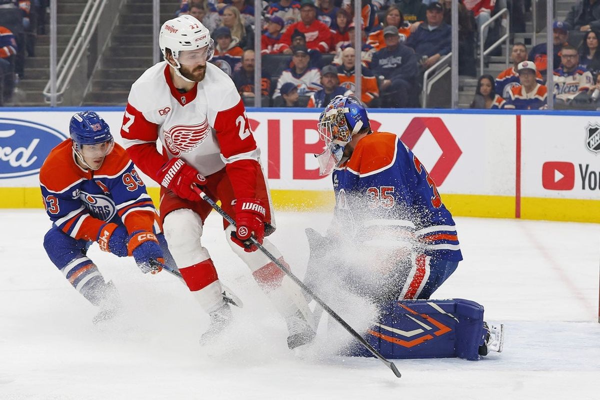 Oct 26, 2026; Edmonton, Alberta, CAN;  Detroit Red Wings forward Michael Rasmussen (27) looks for a loose puck in front of Edmonton Oilers goaltender Tristan Jarry (35) during the second period at Rogers Place.  Mandatory Credit: Perry Nelson-Imagn Images