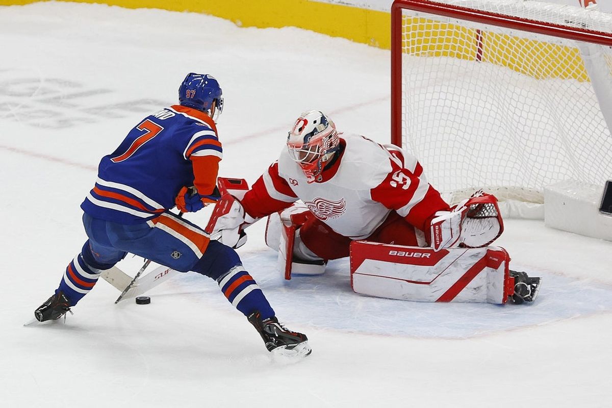 Oct 26, 2026; Edmonton, Alberta, CAN;  Detroit Red Wings goaltender Michal Postava (35) makes a save on Edmonton Oilers forward Connor McDavid (97) during the shoot-out at Rogers Place.  Mandatory Credit: Perry Nelson-Imagn Images