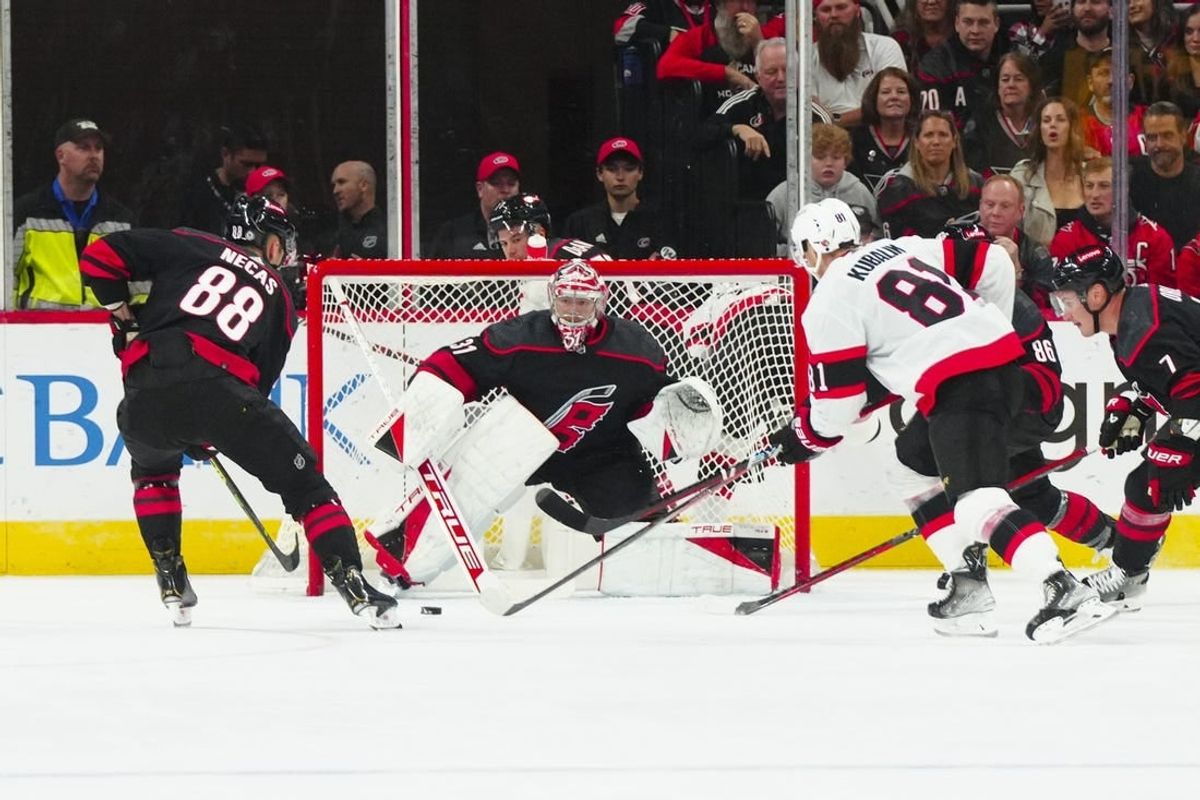 Oct 11, 2023; Raleigh, North Carolina, USA; Carolina Hurricanes goaltender Frederik Andersen (31) center Martin Necas (88) and Ottawa Senators left wing Dominik Kubalik (81) watch the puck during the first period at PNC Arena.