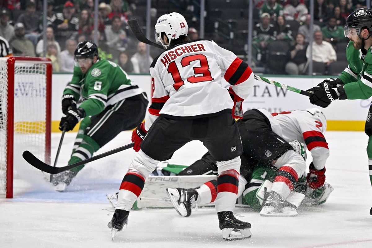 Oct 27, 2026; Dallas, Texas, USA; New Jersey Devils center Nico Hischier (13) scores a goal past Dallas Stars defenseman Lian Bichsel (6) as Devils right wing Timo Meier (28) collides with Stars goaltender Casey DeSmith (1) as during the first period at American Airlines Center. Mandatory Credit: Jerome Miron-Imagn Images