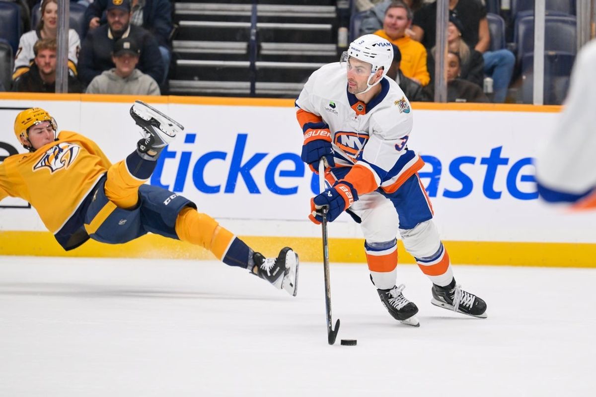 Oct 27, 2026; Nashville, Tennessee, USA;  New York Islanders defenseman Adam Pelech (3) skates with the puck against the Nashville Predators during the first period at Bridgestone Arena.  Mandatory Credit: Steve Roberts-Imagn Images