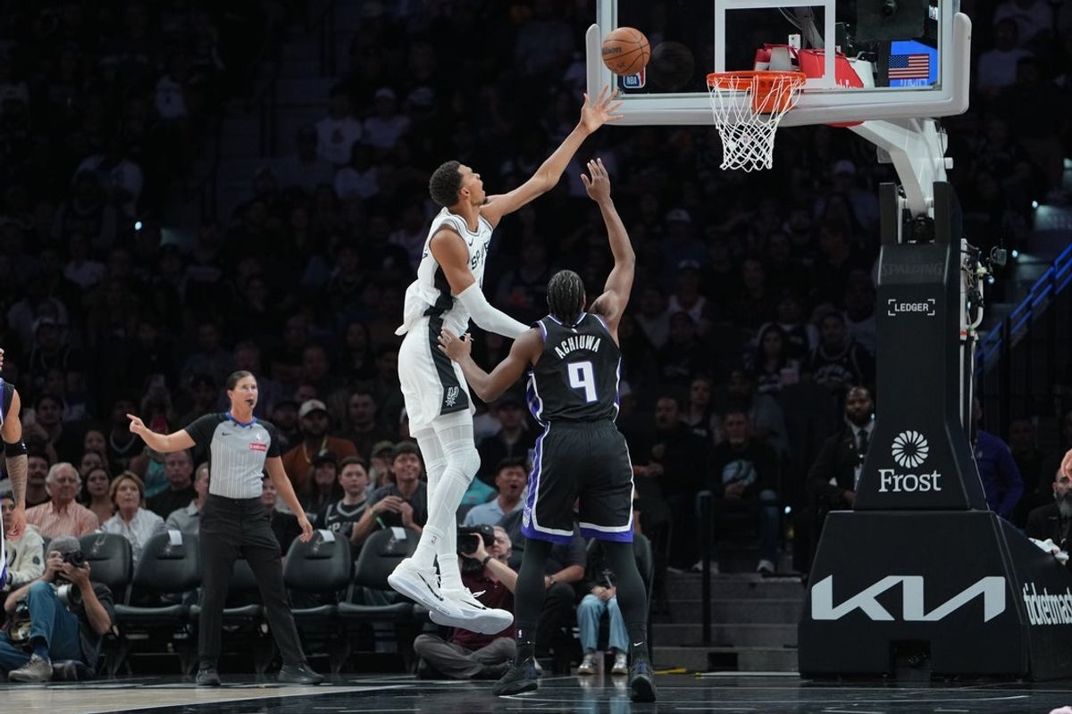Oct 27, 2026; San Antonio, Texas, USA;  San Antonio Spurs forward Victor Wembanyama (1) shoots in front of Sacramento Kings forward Precious Achiuwa (9) in the first half at Frost Bank Center.  Mandatory Credit: Daniel Dunn-Imagn Images