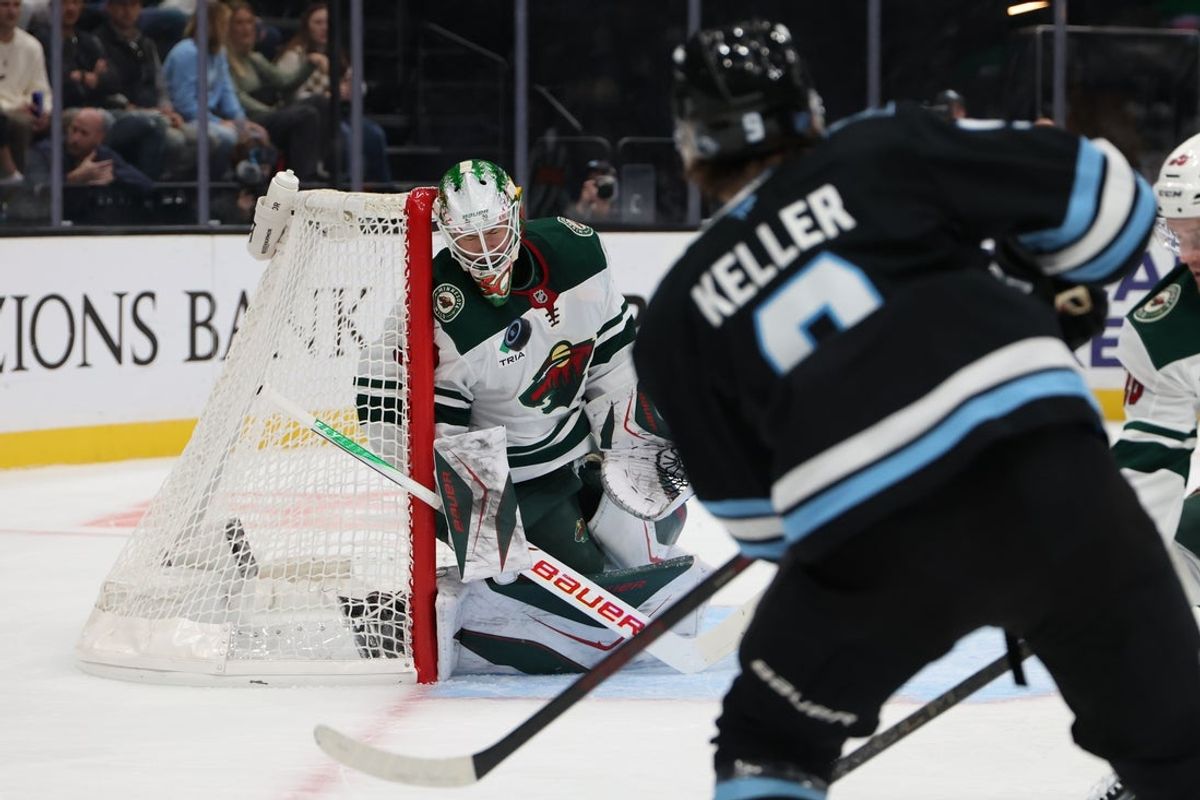 Oct 27, 2026; Salt Lake City, Utah, USA;  Minnesota Wild goaltender Jesper Wallstedt (30) blocks a shot by Utah Mammoth right wing Clayton Keller (9) during the first period at Delta Center.  Mandatory Credit: Rob Gray-Imagn Images