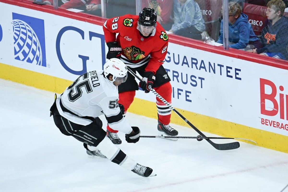 Oct 27, 2026; Chicago, Illinois, USA;  Chicago Blackhawks defenseman Ian Cole (28) and Los Angeles Kings right wing Quinton Byfield (55) chase the puck during the third period at United Center.  Mandatory Credit: Matt Marton-Imagn Images