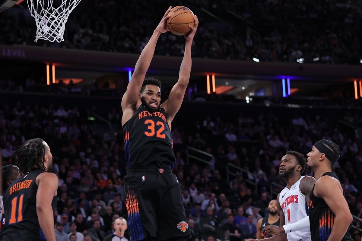 Oct 27, 2026; New York, New York, USA; New York Knicks center Karl-Anthony Towns (32) grabs a rebound against the Detroit Pistons during the fourth quarter at Madison Square Garden. Mandatory Credit: Brad Penner-Imagn Images