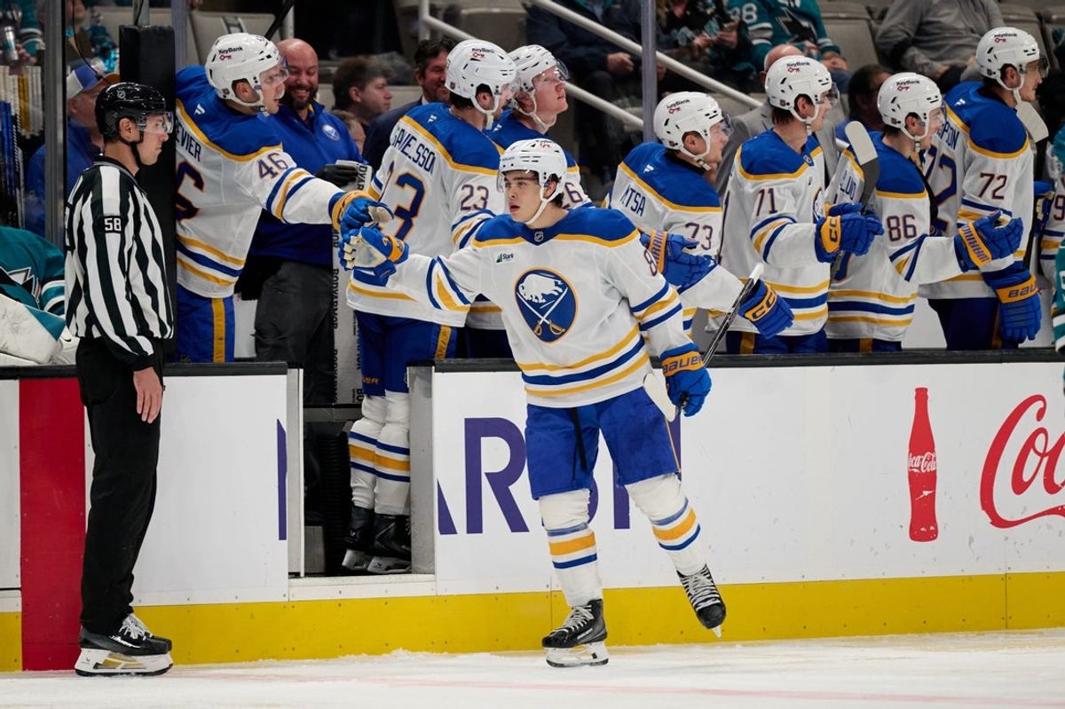Oct 27, 2026; San Jose, California, USA; Buffalo Sabres defenseman Olen Zellweger (8) celebrates with teammates on the bench after scoring a goal against the San Jose Sharks during the second period at SAP Center at San Jose. Mandatory Credit: Robert Edwards-Imagn Images