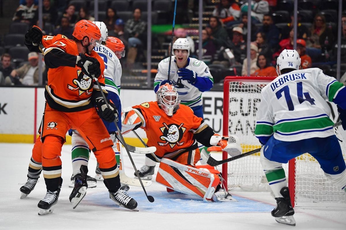 Oct 27, 2026; Anaheim, California, USA; Vancouver Canucks right wing Brock Boeser (6) scores a goal against Anaheim Ducks goaltender Lukas Dostal (1) during the third period at Honda Center. Mandatory Credit: Gary A. Vasquez-Imagn Images