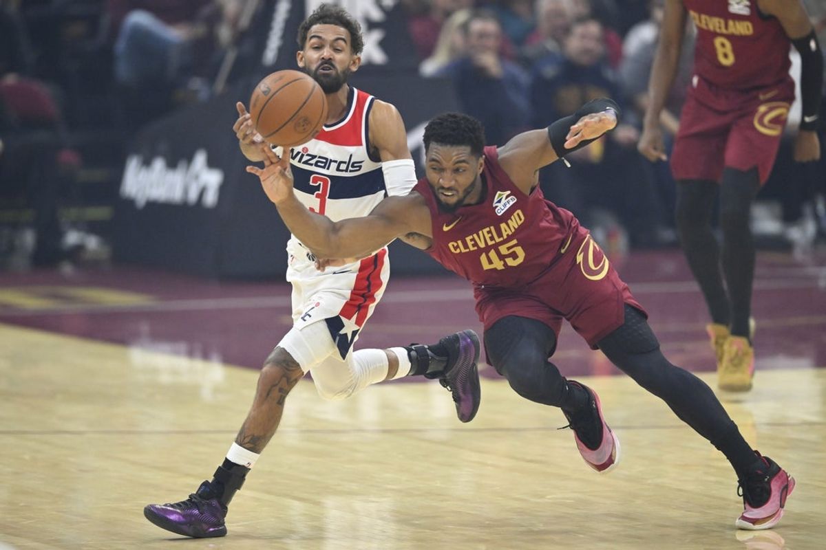 Oct 28, 2026; Cleveland, Ohio, USA;  Cleveland Cavaliers guard Donovan Mitchell (45) defends Washington Wizards guard Trae Young (3) in the first quarter at Rocket Arena.  Mandatory Credit: David Richard-Imagn Images