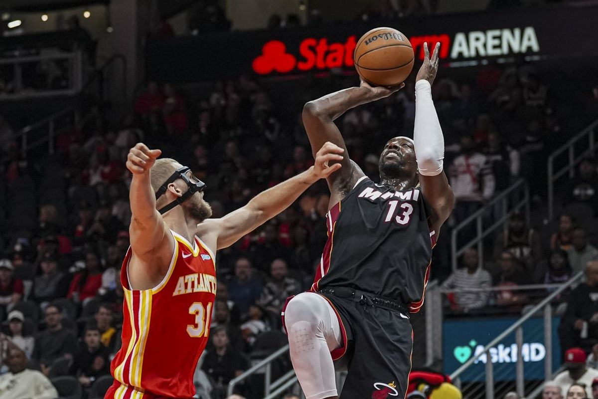 Oct 28, 2026; Atlanta, Georgia, USA; Miami Heat center Bam Adebayo (13) shoots over Atlanta Hawks center Jock Landale (31) during the first half at State Farm Arena. Mandatory Credit: Dale Zanine-Imagn Images