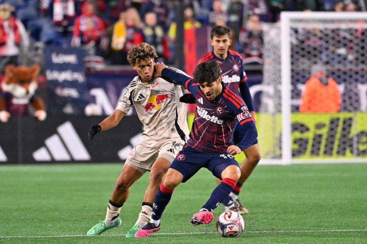 Oct 28, 2026; Foxborough, MA, USA; New England Revolution midfielder Carles Gil (10) controls the ball against Red Bull New York forward Julian Hall (16) during the first half at Gillette Stadium. Mandatory Credit: Eric Canha-Imagn Images