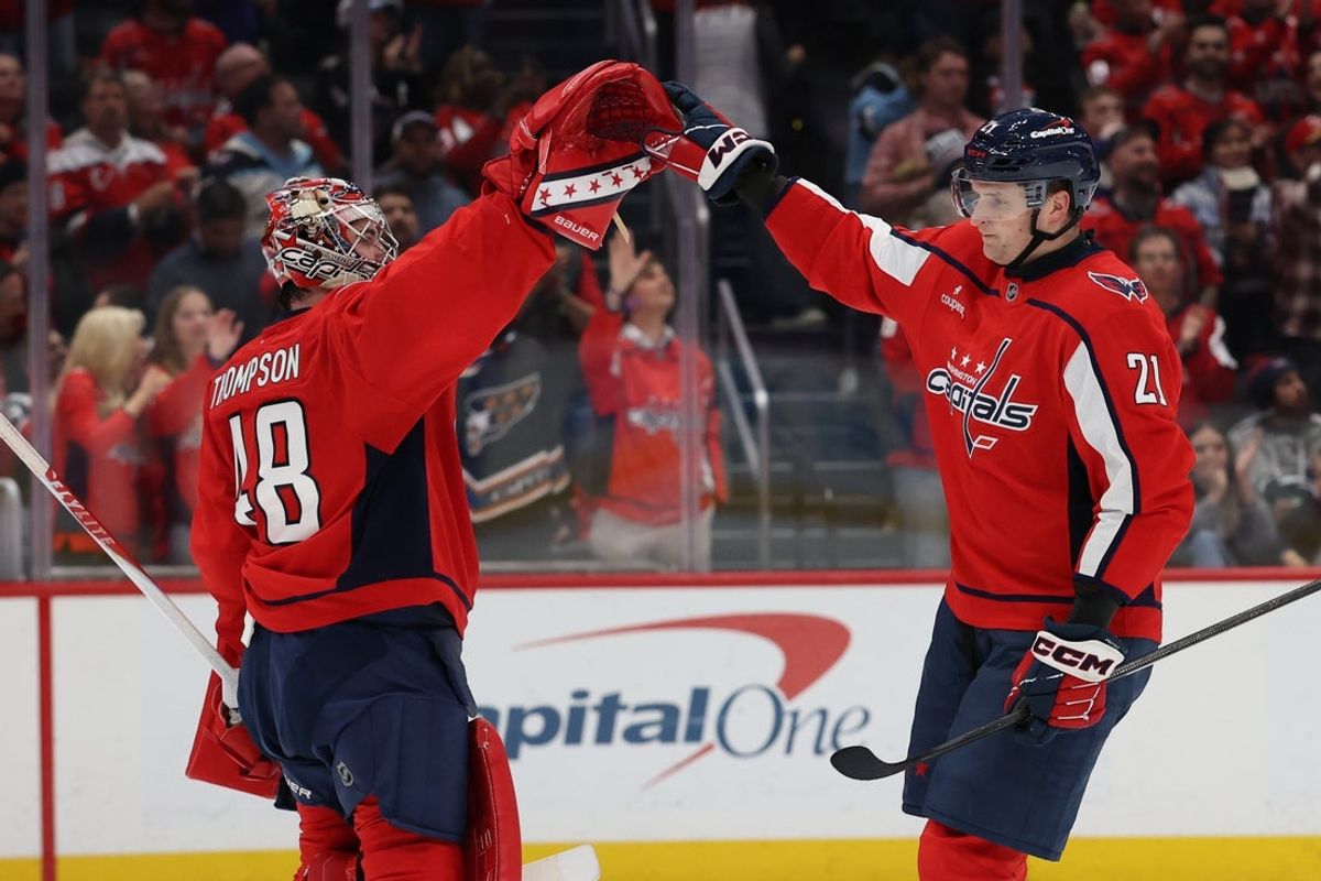 Oct 28, 2026; Washington, District of Columbia, USA; Washington Capitals left wing Aliaksei Protas (21) celebrates with Capitals goaltender Logan Thompson (48) after scoring a goal against the Philadelphia Flyers during the second period at Capital One Arena. Mandatory Credit: Geoff Burke-Imagn Images