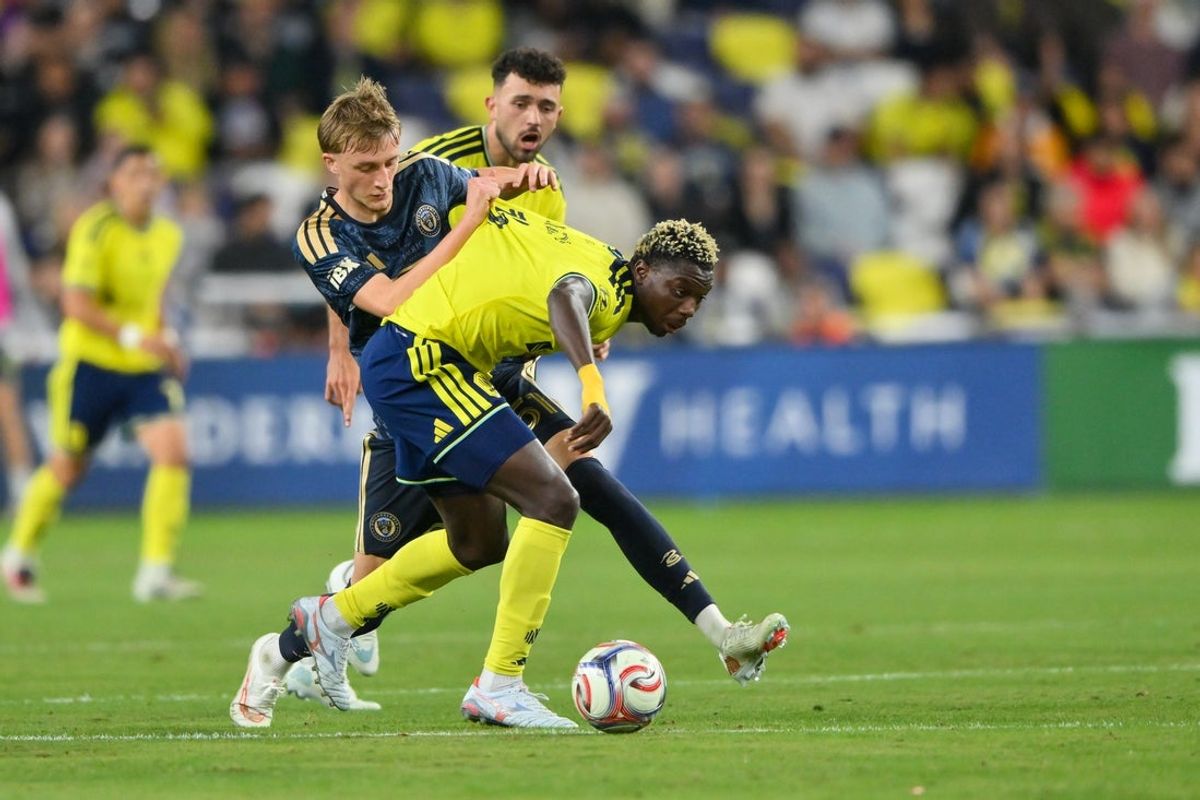 Oct 28, 2026; Nashville, Tennessee, USA;  Philadelphia Union forward Malik Jakupovic (51) and Nashville SC defender Maxwell Woledzi (3) fights for the ball during the first half at Geodis Park.  Mandatory Credit: Steve Roberts-Imagn Images