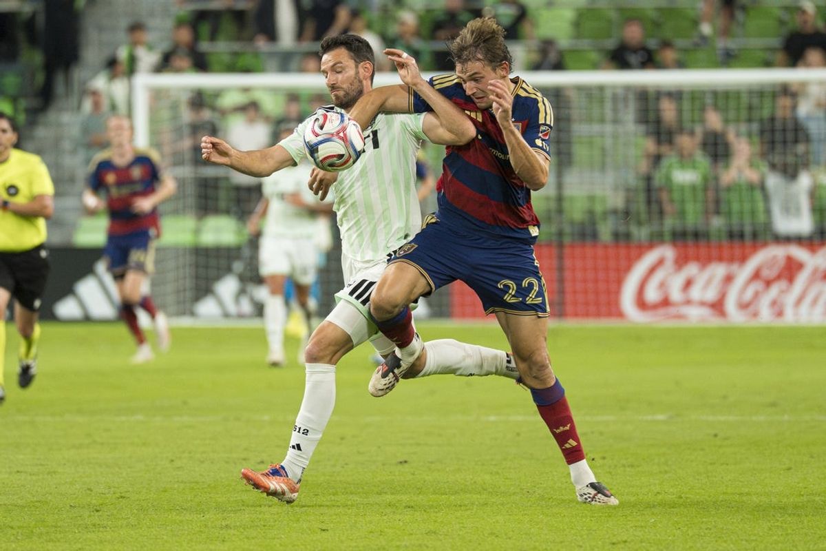 Oct 28, 2026; Austin, Texas, USA;  Real Salt Lake forward Sergi Solans (22) fights for possession of the ball with Austin FC defender Brendan Hines-Ike (4) during the first half of a match between Austin FC and Real Salt Lake at Q2 Stadium.  Mandatory Credit: Daniel Jefferson-Imagn Images