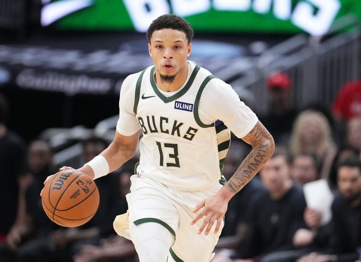 Oct 28, 2026; Milwaukee, Wisconsin, USA;  Milwaukee Bucks guard Ryan Rollins (13) brings the ball up the court against the Houston Rockets at Fiserv Forum.  Mandatory Credit: Michael McLoone-Imagn Images