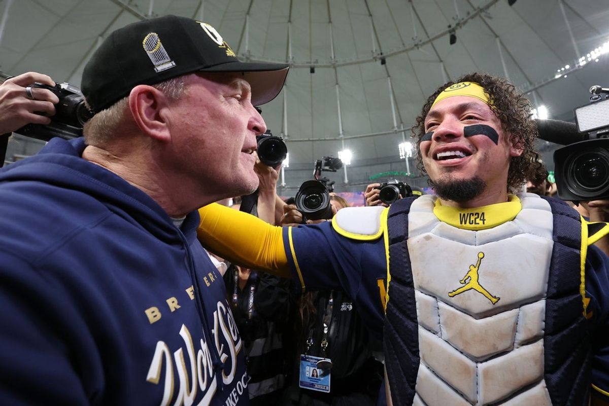 Oct 28, 2026; St. Petersburg, Florida, USA;  Milwaukee Brewers manager Pat Murphy (00) and catcher William Contreras (24) celebrate defeating the Tampa Bay Rays in game five of the 2026 World Series at Tropicana Field.  Mandatory Credit: Kim Klement Neitzel-Imagn Images