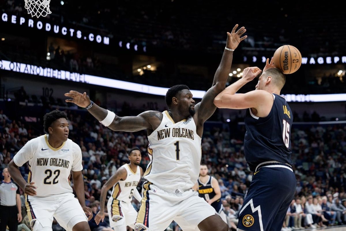 Oct 28, 2026; New Orleans, Louisiana, USA;  Denver Nuggets center Nikola Jokic (15) has his shot deflect onto his head by New Orleans Pelicans forward Zion Williamson (1) during the second half at Smoothie King Center.  Mandatory Credit: Matthew Hinton-Imagn Images