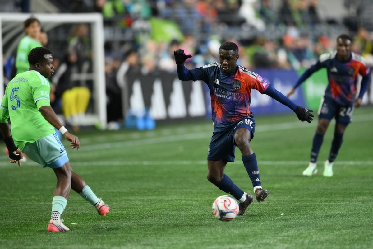 Oct 28, 2026; Seattle, Washington, USA; Houston Dynamo FC midfielder Diadie Samassekou (18) plays defense against Seattle Sounders FC defender Nouhou (5) during the first half at Lumen Field. Mandatory Credit: Steven Bisig-Imagn Images