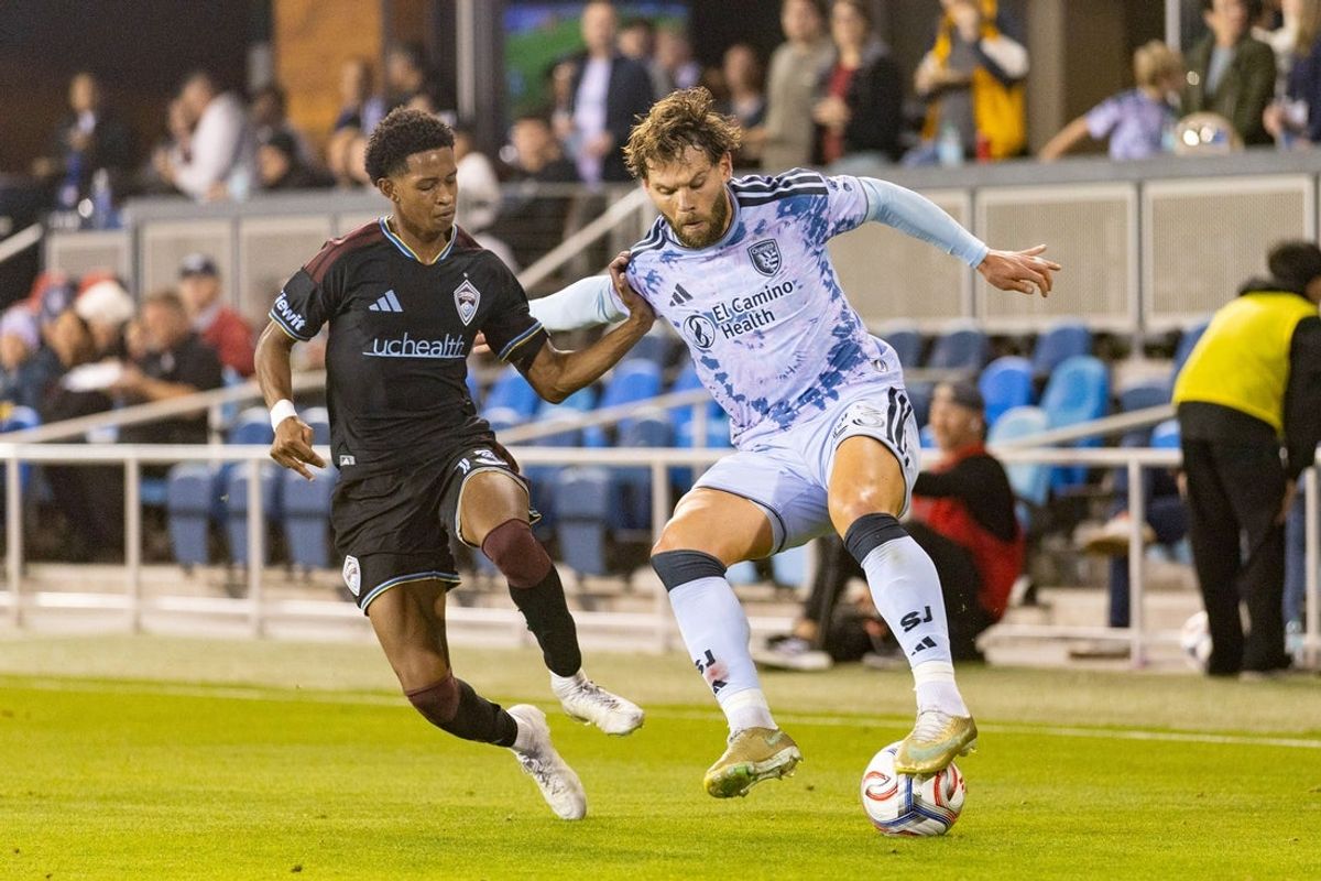 Oct 28, 2026; San Jose, California, USA;  Colorado Rapids midfielder Wayne Frederick (13) and San Jose Earthquakes midfielder Eduard Lowen (23) battle for the ball during the first half at PayPal Park.  Mandatory Credit: Stan Szeto-Imagn Images