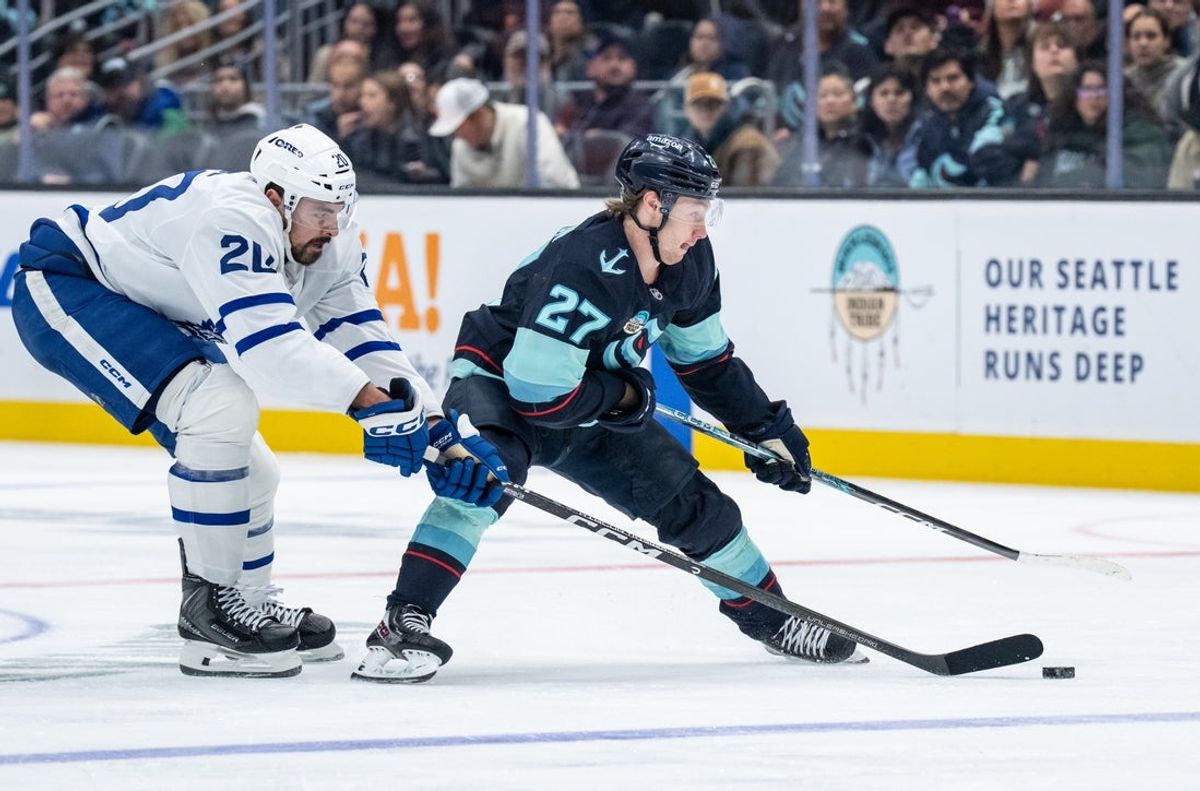Oct 28, 2026; Seattle, Washington, USA; Seattle Kraken forward Berkly Catton (27) skates against Toronto Maple Leafs forward Nick Paul (20) during the second period at Climate Pledge Arena. Mandatory Credit: Stephen Brashear-Imagn Images