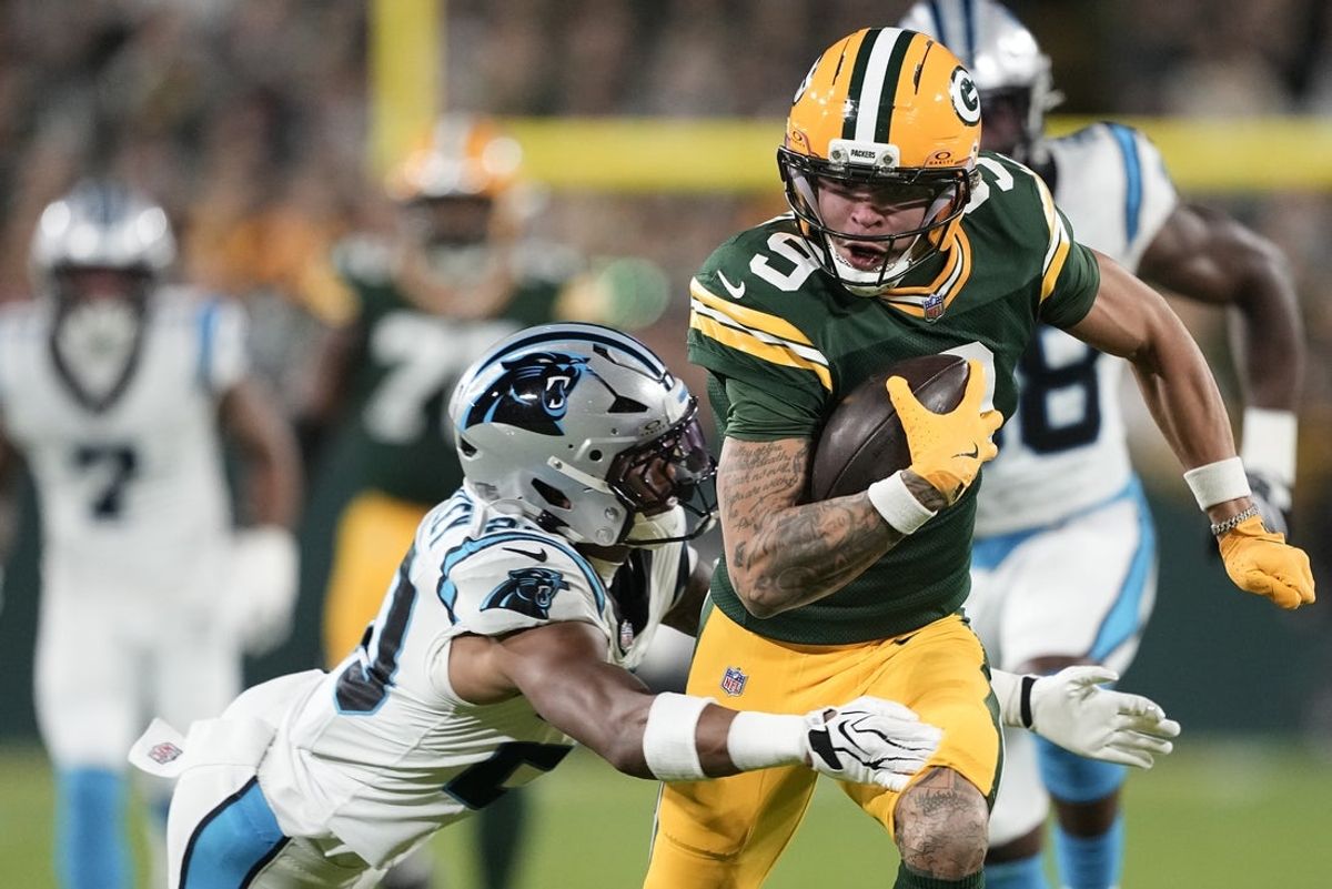 Oct 29, 2026; Green Bay, Wisconsin, USA;  Green Bay Packers wide receiver Christian Watson (9) makes a catch against the Carolina Panthers at Lambeau Field.  Mandatory Credit: Jeff Hanisch-Imagn Images