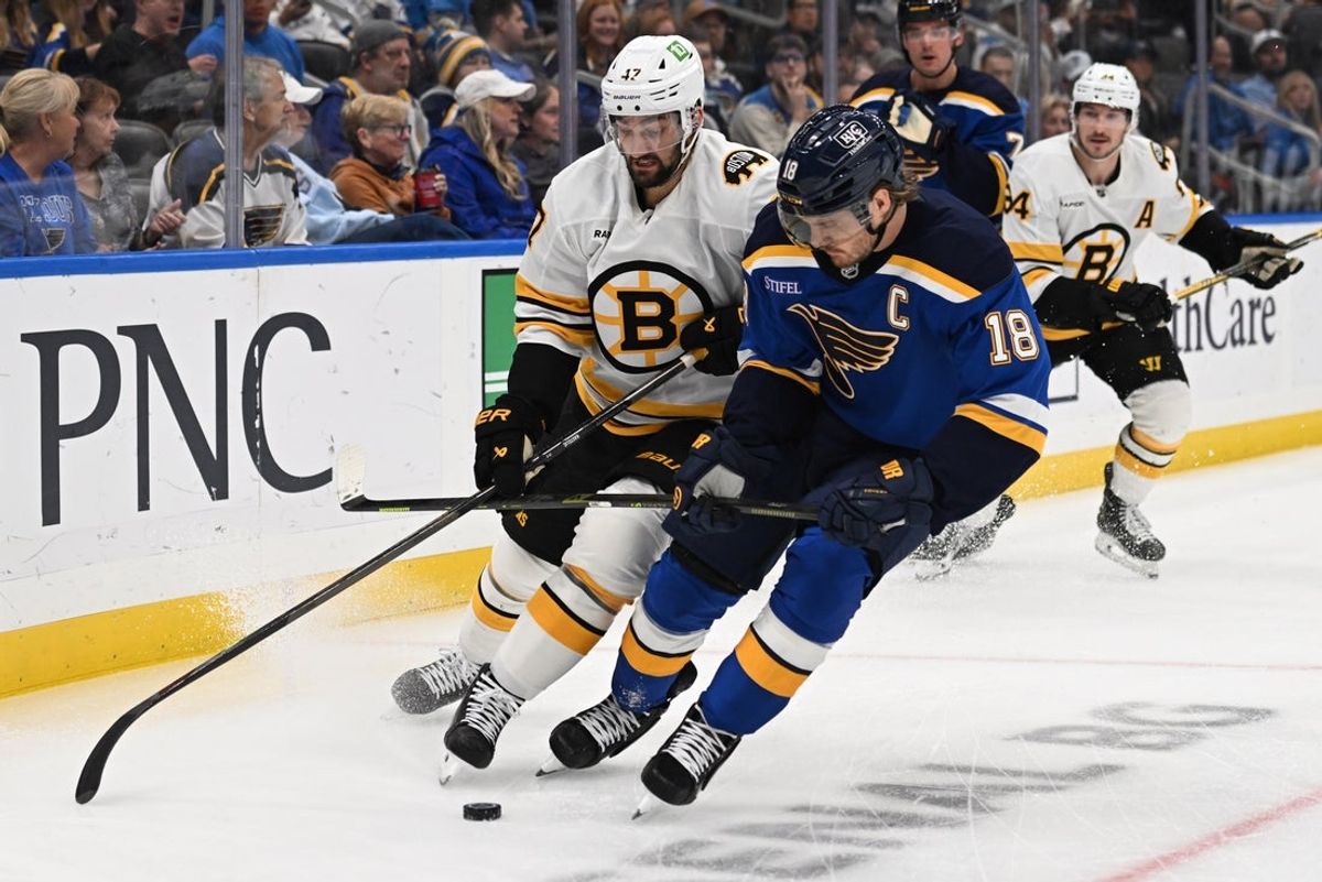 Oct 29, 2026; St. Louis, Missouri, USA;  Boston Bruins center Mark Kastelic (47) and St. Louis Blues center Robert Thomas (18) battle for the puck in the first period at Enterprise Center.  Mandatory Credit: Joe Puetz-Imagn Images