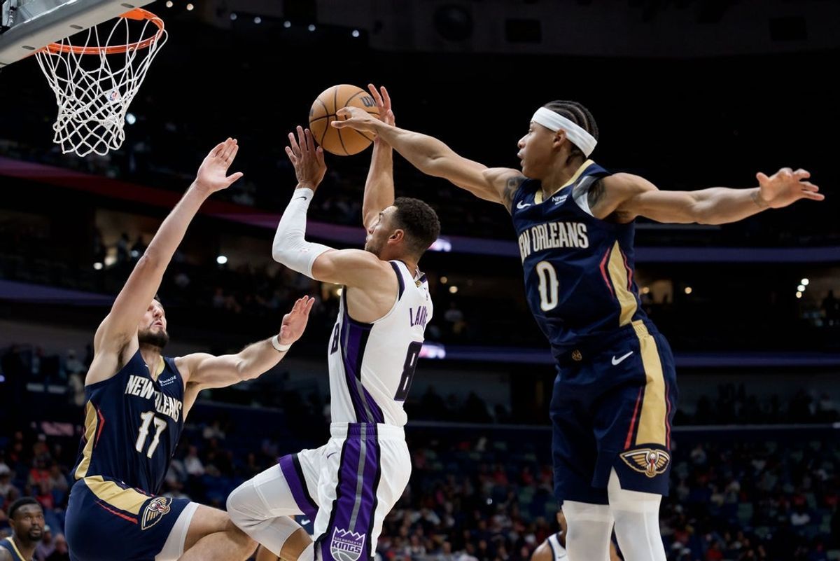Oct 29, 2026; New Orleans, Louisiana, USA;  Sacramento Kings guard Zach LaVine (8) has his ball tipped by New Orleans Pelicans guard Jeremiah Fears (0) before forward Karlo Matkovic (17) blocks it during the first half at Smoothie King Center.  Mandatory Credit: Matthew Hinton-Imagn Images