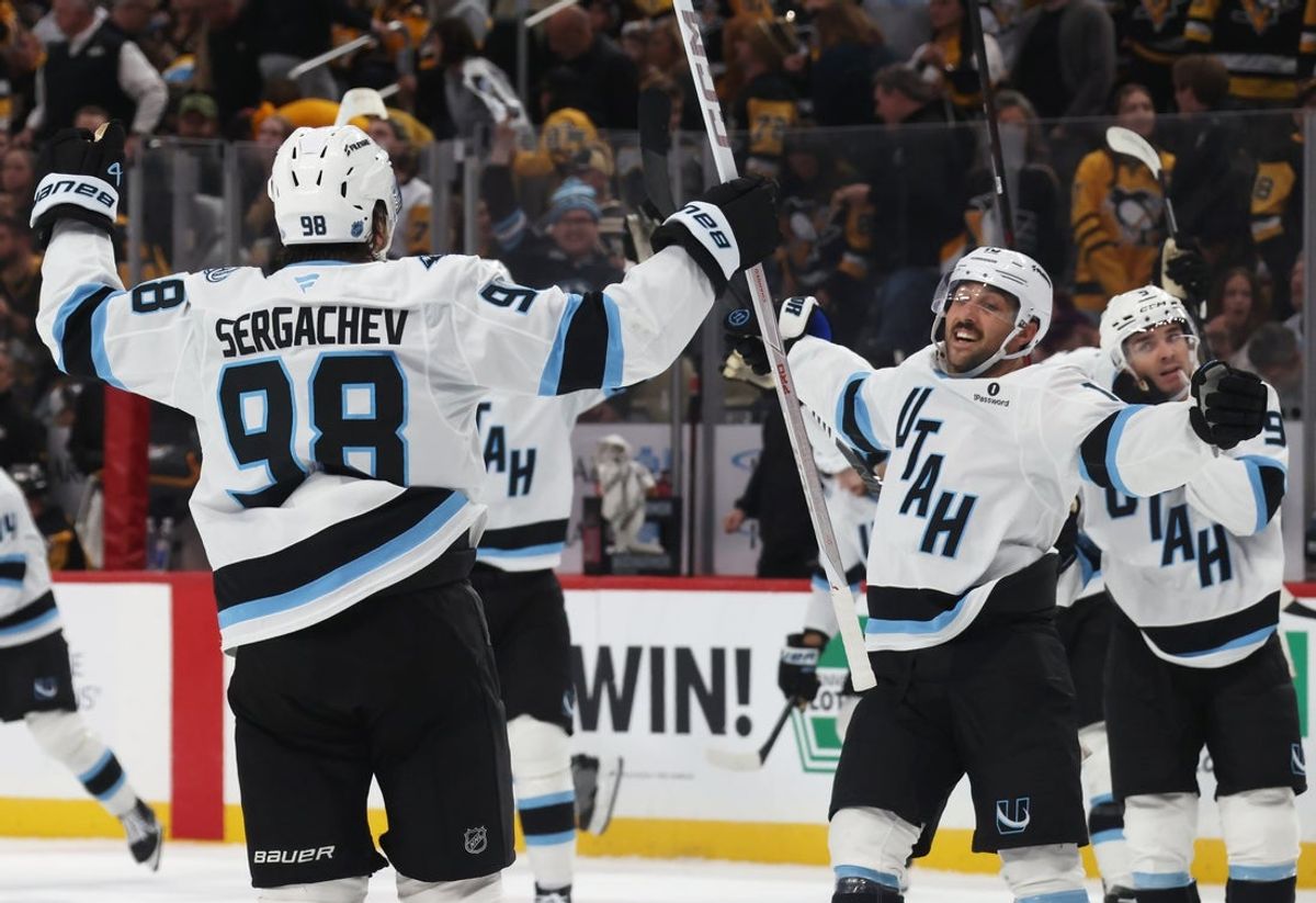 Oct 29, 2026; Pittsburgh, Pennsylvania, USA;  Utah Mammoth defenseman Mikhail Sergachev (98) celebrates his game winning overtime goal with center Vincent Trocheck (16) to defeat the Pittsburgh Penguins at PPG Paints Arena.  Mandatory Credit: Charles LeClaire-Imagn Images