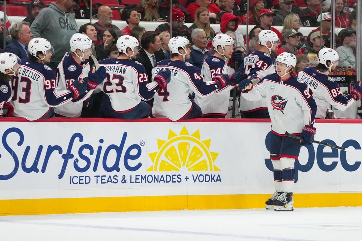 Oct 29, 2026; Raleigh, North Carolina, USA;  Columbus Blue Jackets center Kent Johnson (91) celebrates his goal against the Carolina Hurricanes during the third period at Lenovo Center.  Mandatory Credit: James Guillory-Imagn Images