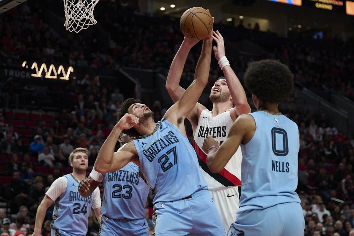 Oct 29, 2026; Portland, Oregon, USA; Memphis Grizzlies forward Cameron Boozer (27) and Portland Trail Blazers center Donovan Clingan (23) battle for control of a rebound during the first half at Moda Center. Mandatory Credit: Troy Wayrynen-Imagn Images