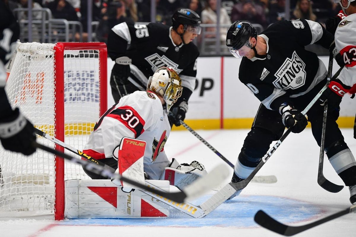 Oct 29, 2026; Los Angeles, California, USA; Los Angeles Kings right wing Corey Perry (90) moves in for the rebound against Ottawa Senators goaltender Samuel Ersson (30) during the second period at Crypto.com Arena. Mandatory Credit: Gary A. Vasquez-Imagn Images