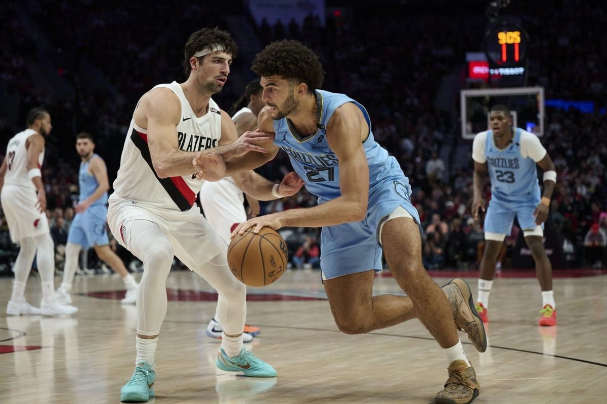 Oct 29, 2026; Portland, Oregon, USA; Memphis Grizzlies forward Cameron Boozer (27) drives to the basket during the second half against Portland Trail Blazers forward Deni Avdija (8) at Moda Center. Mandatory Credit: Troy Wayrynen-Imagn Images